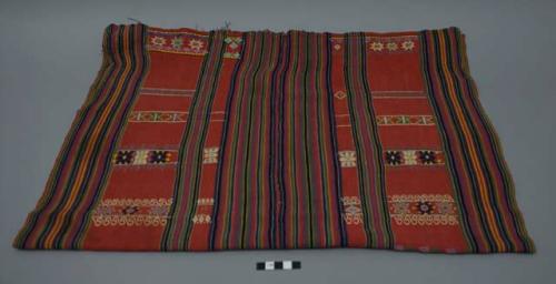 Textile, two panels sewn together, red ground with green, blue, purple, and yellow stripes, floral embriodery