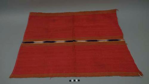 Textile, red ground with thin tan bands and central white, blue, and orange band