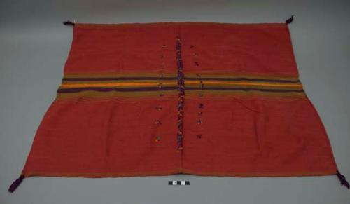 Textile, red ground with tan, orange, green, and purple bands and central brocade