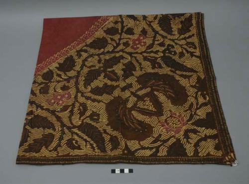 Textile, brown ground with tan, dark brown, and red floral pattern and central red diamond design