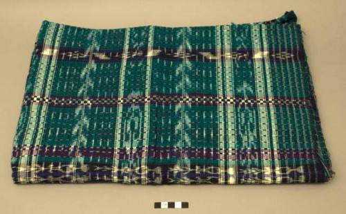 Textile, green ground with intersecting navy, purple, and blue solid and jaspe stripes. The textile has an odd odor.