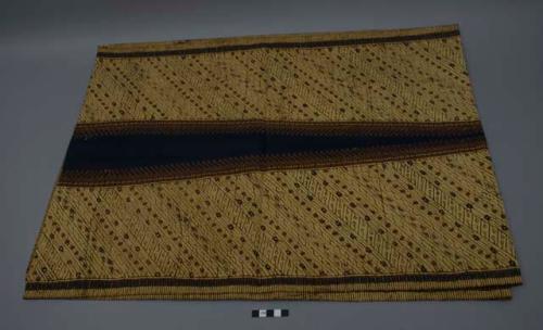 Textile, tan ground with navy and brown diagonal pattern, elongated central navy diamond design