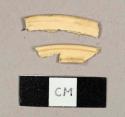 Tan plastic fragments, curved rim sherds