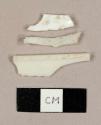 White plastic fragments, including one possible spoon or spork fragment