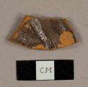 Refined redware sherd with brown glaze on interior