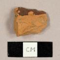 Refined redware sherd with brown glaze on one side and lead glaze on the other