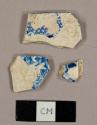 Blue transfer print whiteware sherds, including at least two Willow Ware sherds and one plate rim