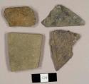 Two slate fragments and two Cambridge mudstone fragments