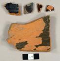 Lead glazed redware sherds, including one saucer? rim sherd and one with an allover luster glaze on the exterior