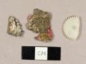 20th century plastic and foil fragments, including one gear fragment