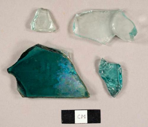 Aqua bottle glass fragments, one with "E/N" embossed on exterior