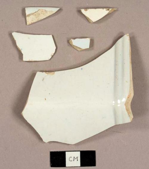 Ironstone sherds, including one faceted sherd, one rim fragment of a saucer, and one footed base fragment of a bowl