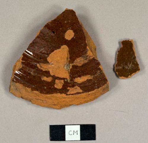 Lead glazed refined redware sherds, including one base fragment of a bowl or jar