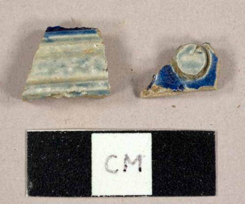 Rhenish stoneware sherds with cobalt decoration, one with molded designs and one with incised designs