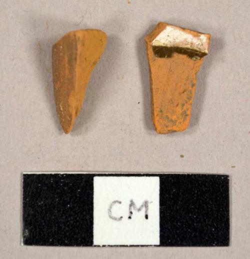 Refined redwares sherd, one unglazed, one with slip decoration and lead glaze