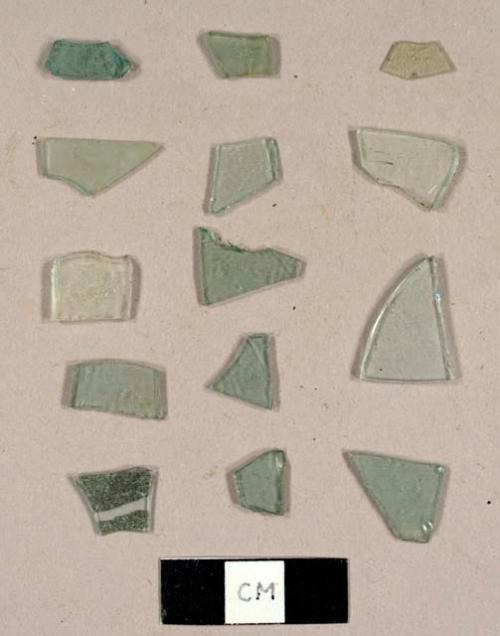 Aqua flat glass fragments, including one mirror fragment