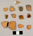 Refined red earthenware sherds, including some redware sherds with lead glaze and one tin-glazed sherd