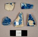 Blue on white transfer printed pearlware sherds, including one rim to a plate and one rim to a spouted vessel