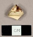 Whieldon ware base sherd of a saucer with mottled manganese decoration