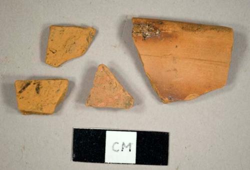 Unglazed redware sherds, including a rim sherd to a pan