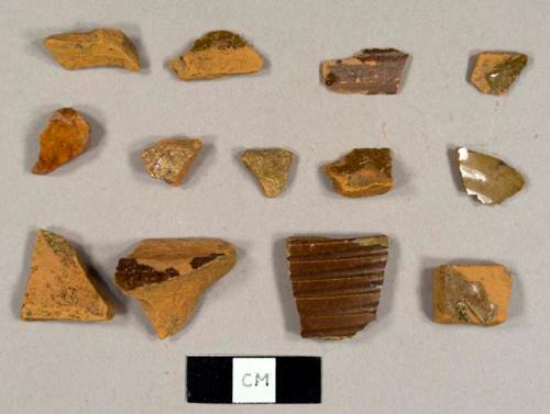 Lead glazed refined redware sherds, one with a molded ribbed design, possibly a neck to a jug