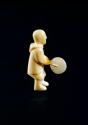Ivory carving - man playing a drum