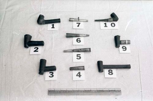 Ten pipes, with a ruler for measurement