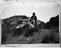 Navajo woman drying wool