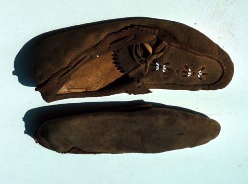 Pair skin moccasins - beading on tongue and fringed