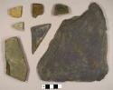 Stone fragments, including Cambridge mudstone, slate, and one possible roof tile