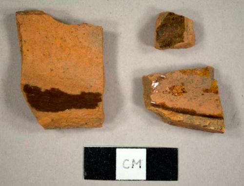 Lead glazed refined redware sherds, including one possible base sherd to a mug