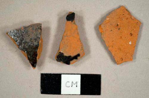 Redware sherds, including one with a lead glazed interior and lustrious exterior and one Jackfield-type ware