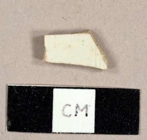 White salt-glazed stoneware sherd, with molded ridges on one side