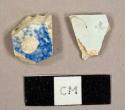 Earthenware sherds, including one pearlware with a clover stamp on one side and blue transfer print on reverse and one blue sponge decorated ware