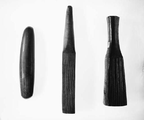 Stone bark beater; Tapa beater of hard dark wood; Tapa beaters