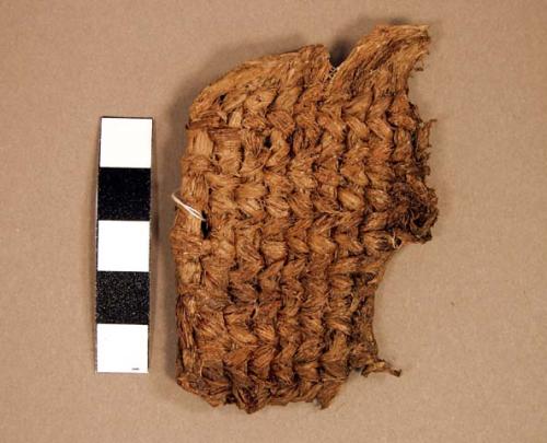 "Woven fragment, fiber (possible sandal)"