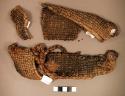 "Woven fragment, fiber (Possible sandals)"