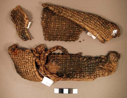 "Woven fragment, fiber (Possible sandals)"