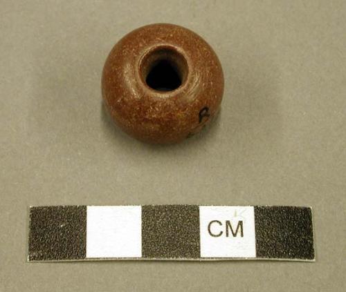 Globular bead; cut from stone closely resembling catlinite