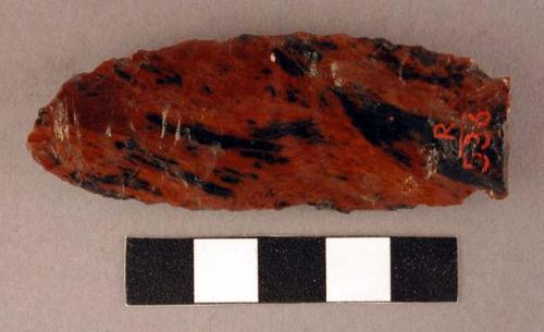 Chipped implement, red & black mottled obsidian