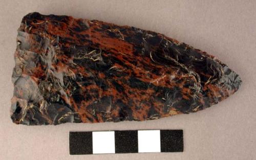 Chipped implement, mottled obsidian