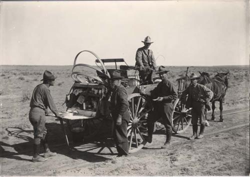 Upper figure S. G. Morley, N.M. Judd at tail of wagon, driver A.V. Kidder, E. H. Morris