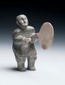 Stone carving - man playing a drum