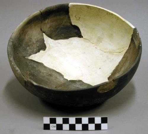 Ceramic bowl, burned exterior, reconstructed