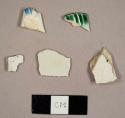 Pearlware sherds, including one with blue feather edging and one green shell-edged plate rim sherd
