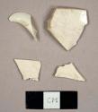Creamware sherds, including one charger rim sherd and one footed cup base sherd
