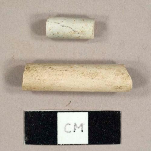 White kaolin pipe stem fragments, one 5/64ths and one 6/64ths