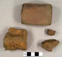 Brick fragments, including one unglazed redware sherd