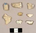 Miscellaneous earthenware sherds, including creamware fragments, one pearlware sherd, one whiteware sherd with blue transfer print, and one plate base fragment