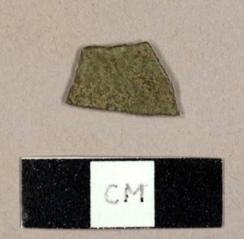 Burned olive green glass fragment